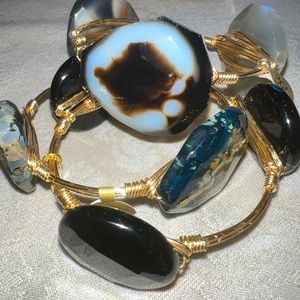 Bourbon and Boweties black stack of 3. Gold bangles with Black and Tan stones.